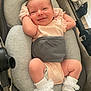 baby, infant, smiling, baby_seat, cushion, soft_toys, white_socks, pastel_clothing, happy, relaxed, indoors, cute, newborn, child, person, portrait, small_hands, small_feet, head, face