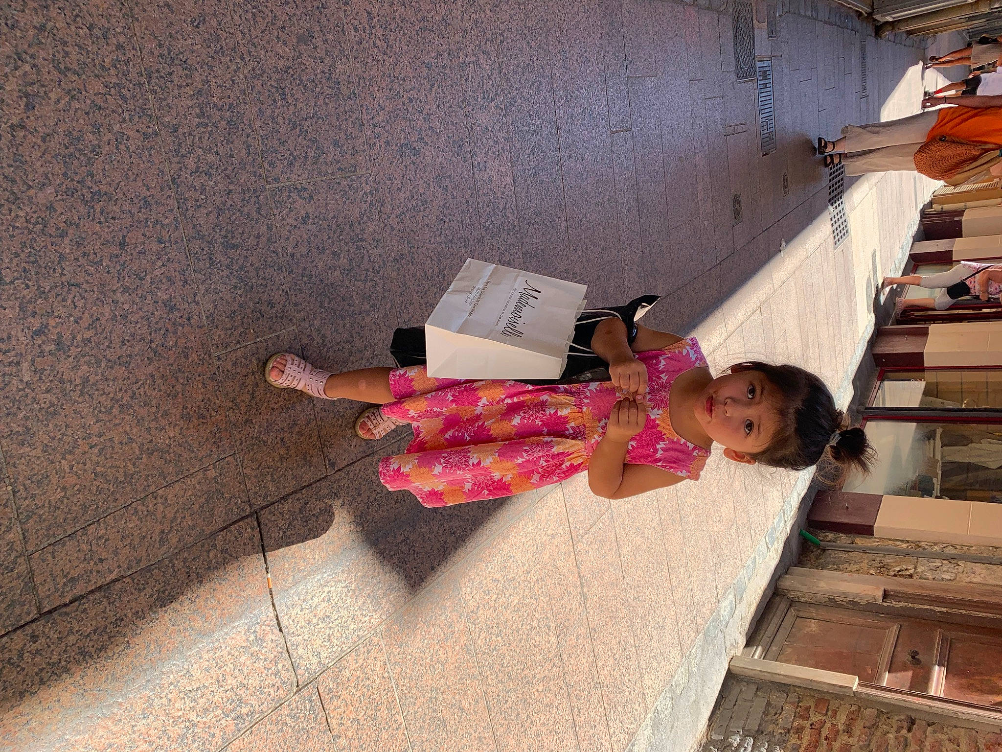 Angelina participe au concours pour gagner de l'argent avec cette photo : child, concrete, dress, floor, flooring, fun, hardwood, human_leg, leisure, magenta, person, pink, room, sidewalk, textile, tints_and_shades, toddler, tree, waist, wall