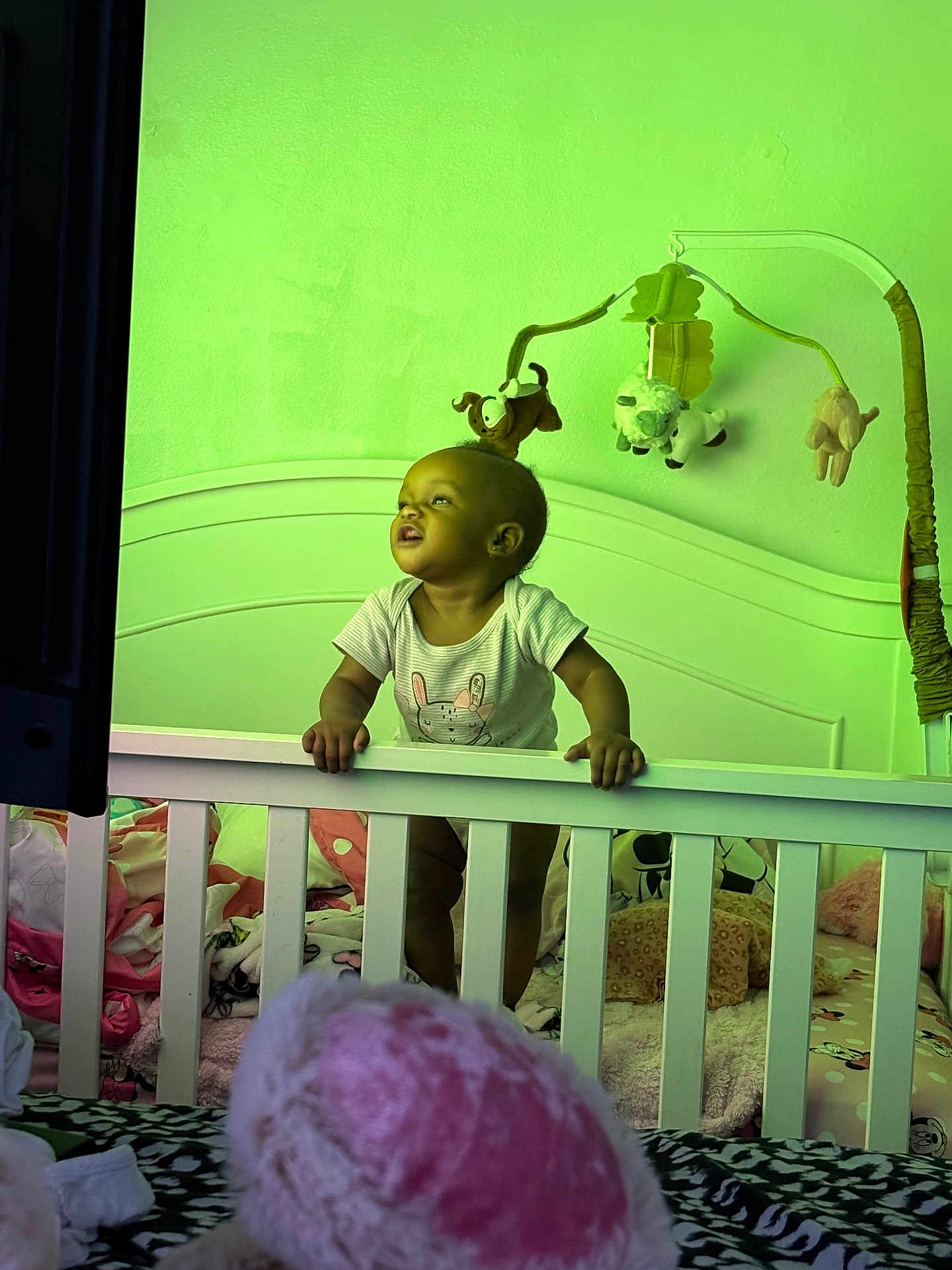 Kehlani joined the competition — help win amazing prizes! baby, crib, mobile, plush_toys, blanket, bedding, nursery, child, infant, furniture, room, standing, grip, clothing, toy, head, face, indoor, curious, colorful