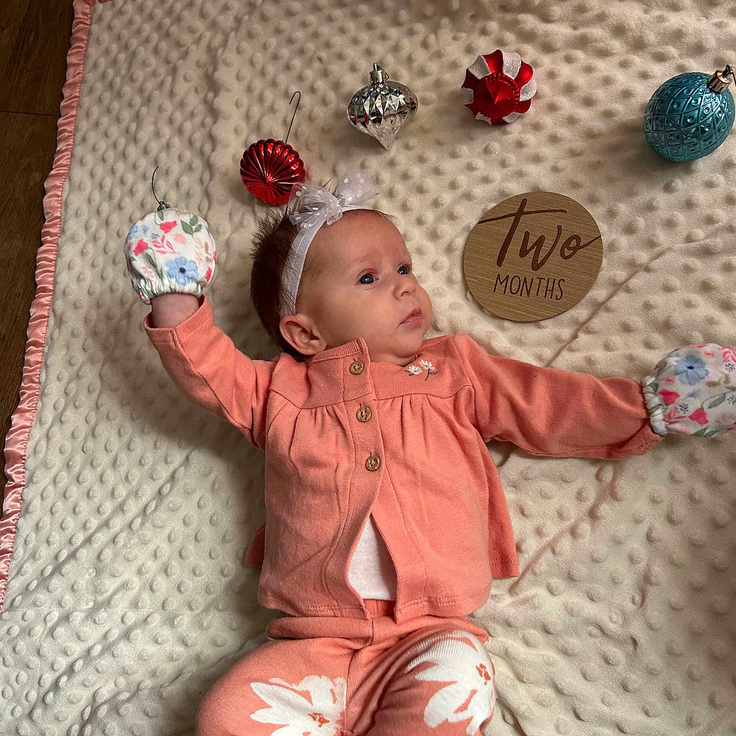 Arainia is registered to the contest to win money with this photo: accessories, baby, bodypart, bonnet, cap, clothing, diamond, face, finger, furniture, gemstone, hand, hat, head, jewelry, pants, person, photography, portrait, quilt