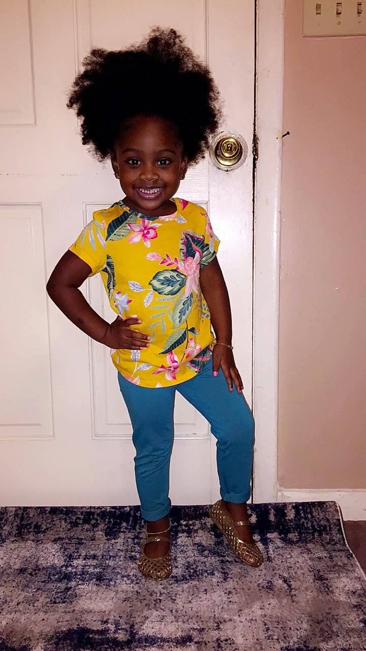 Aava Young is registered to the contest to win money with this photo: afro, black_hair, child, hair, hairstyle, jeans, joy, person, standing, t_shirt, toddler, yellow