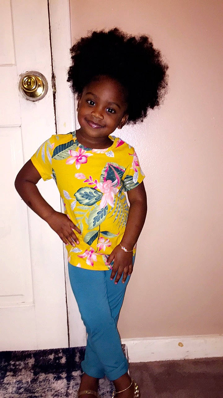 Aava Young is registered to the contest to win money with this photo: afro, black_hair, child, child_model, clothing, hairstyle, joy, pajamas, person, smile, t_shirt, toddler, yellow