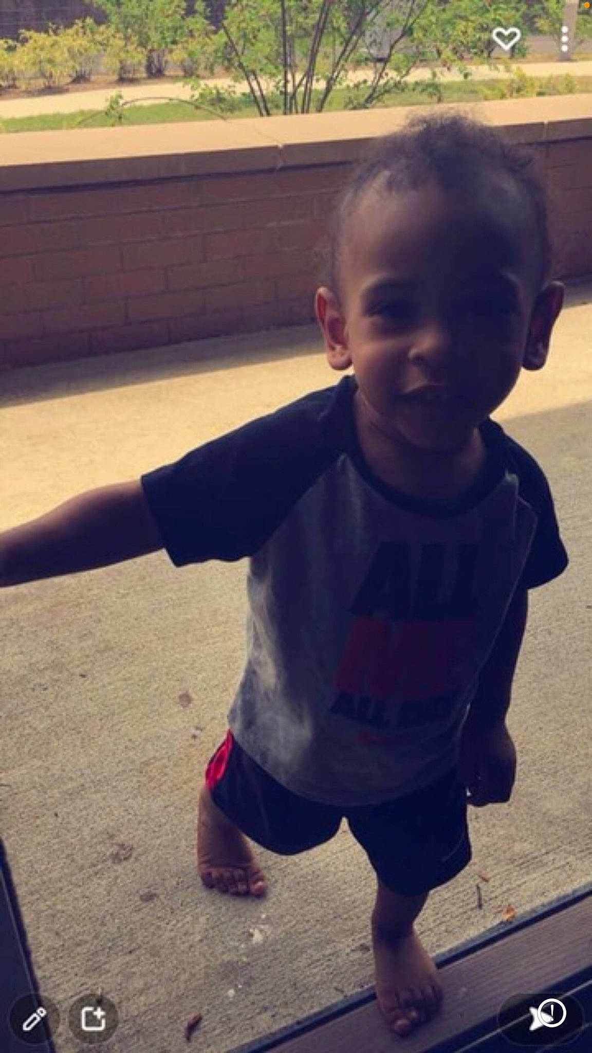 Aidan is registered to the contest to win money with this photo: baby, baby_toddler_clothing, chin, cool, finger, grass, hand, happy, head, mammal, morning, mouth, nose, person, shoulder, sleeve, smile, sunlight, t_shirt, toddler