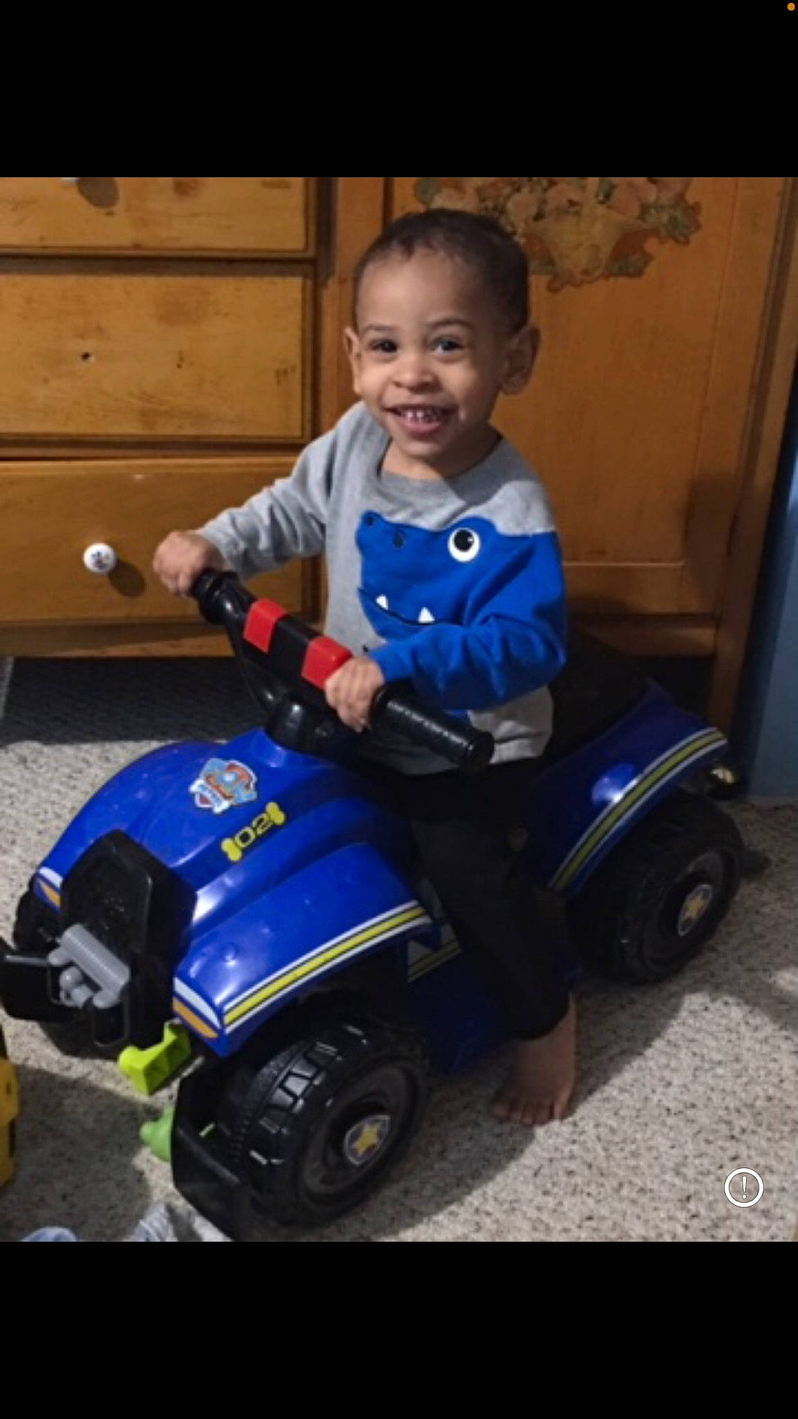 Aidan is registered to the contest to win money with this photo: automotive_design, automotive_tire, automotive_wheel_system, baby, baby_toddler_clothing, child, electric_blue, fender, fun, happy, joy, motor_vehicle, person, riding_toy, rolling, sitting, smile, tire, toddler, tread
