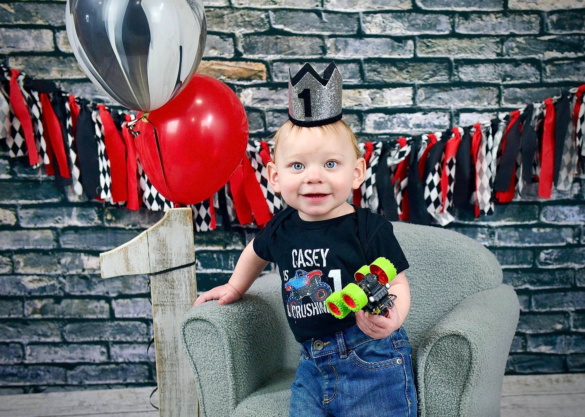 Casey joined the competition — help win amazing prizes! baby, baby_toddler_clothing, brick, brickwork, child, cool, costume_hat, fashion_accessory, flash_photography, fun, happy, hat, headgear, joy, pattern, people, person, red, sitting, smile