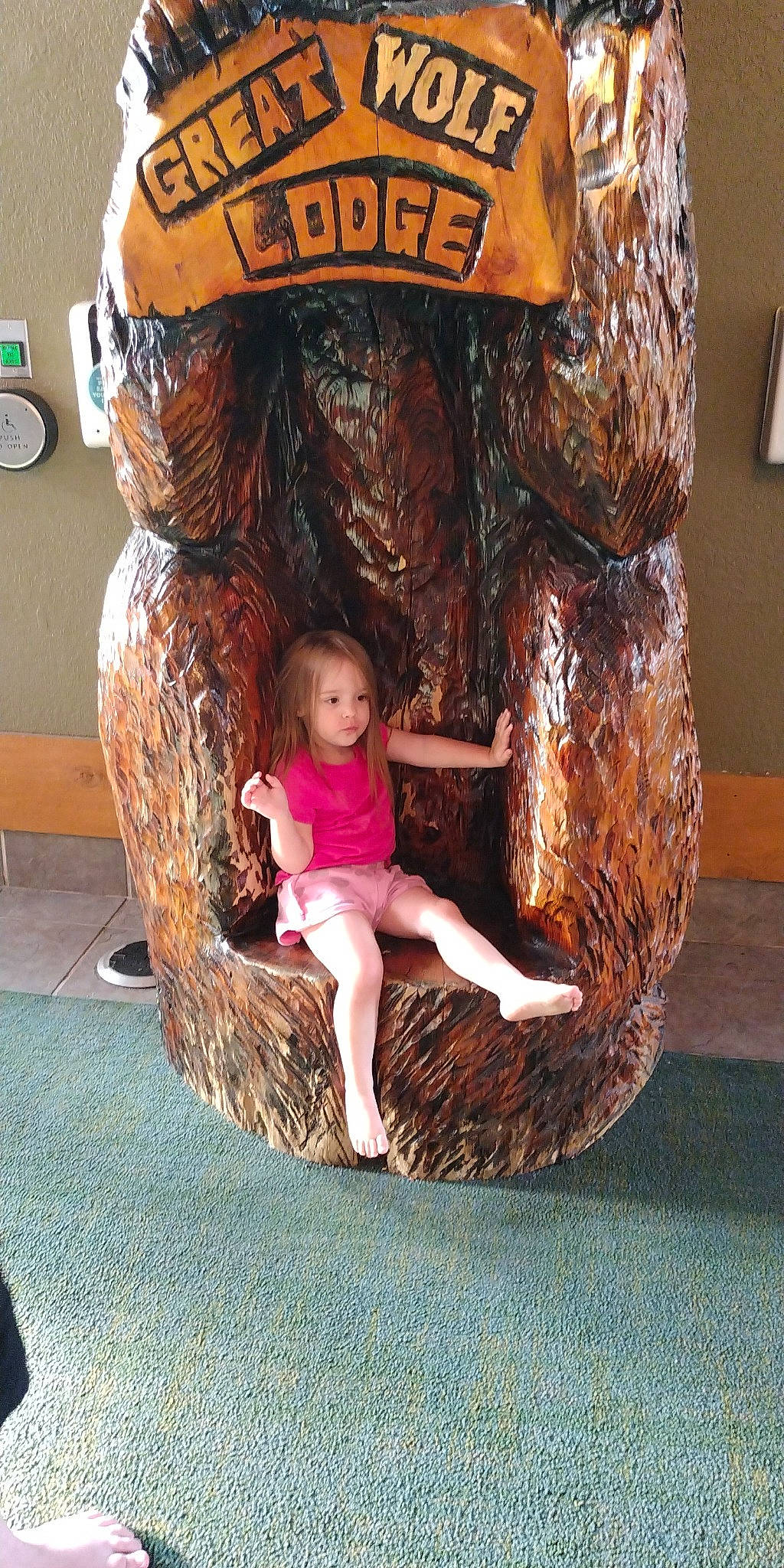 Londyn is registered to the contest to win money with this photo: art, artifact, automotive_tire, automotive_wheel_system, child, flooring, foot, fun, leisure, mammal, person, play, recreation, sandal, shorts, t_shirt, textile, toddler, tree, visual_arts