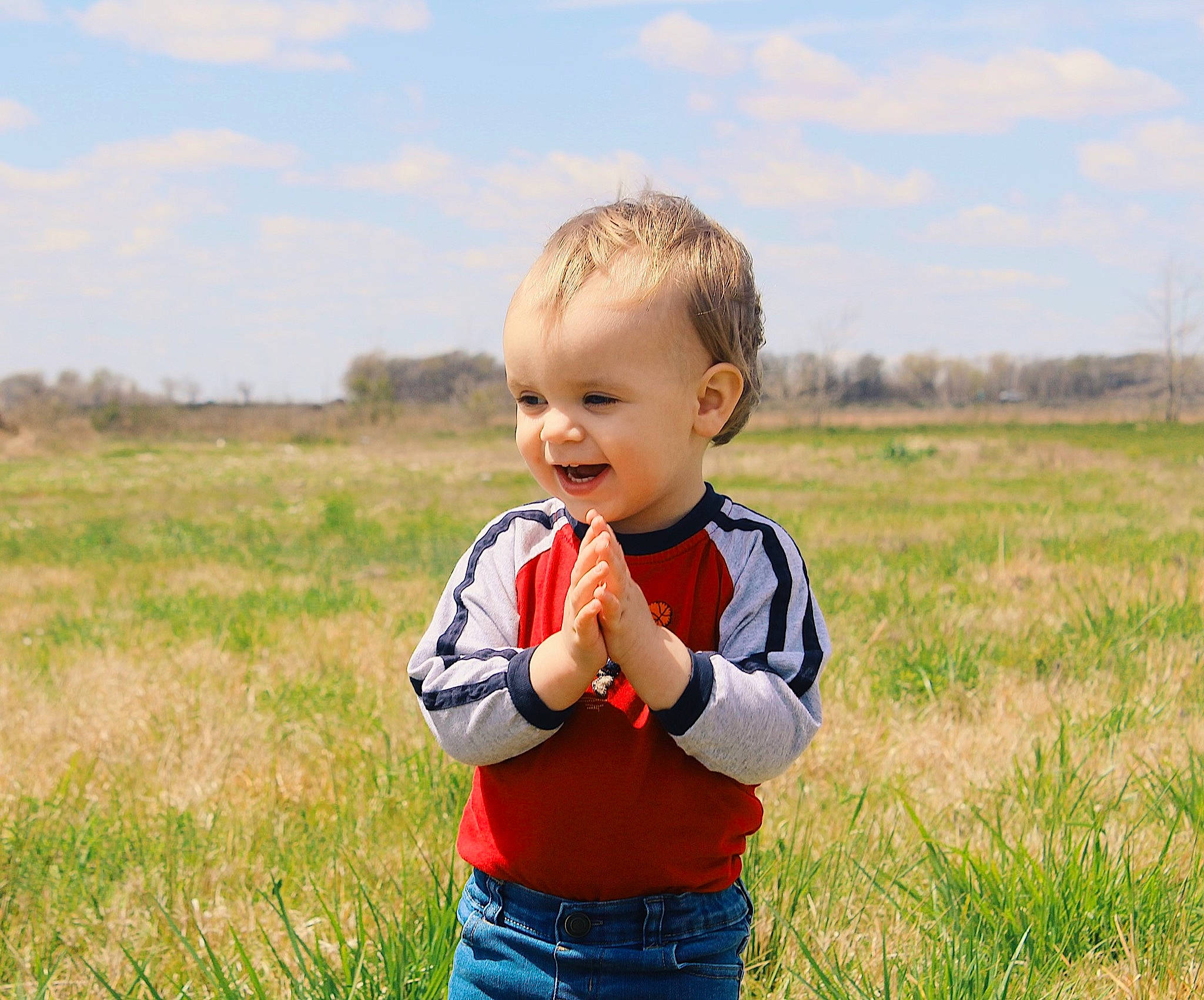 Kohen joined the competition — help win amazing prizes! baby, baby_toddler_clothing, blond, child, clothing, cloud, field, fun, grass, grassland, happy, landscape, meadow, natural_landscape, people_in_nature, person, plant, prairie, sky, smile