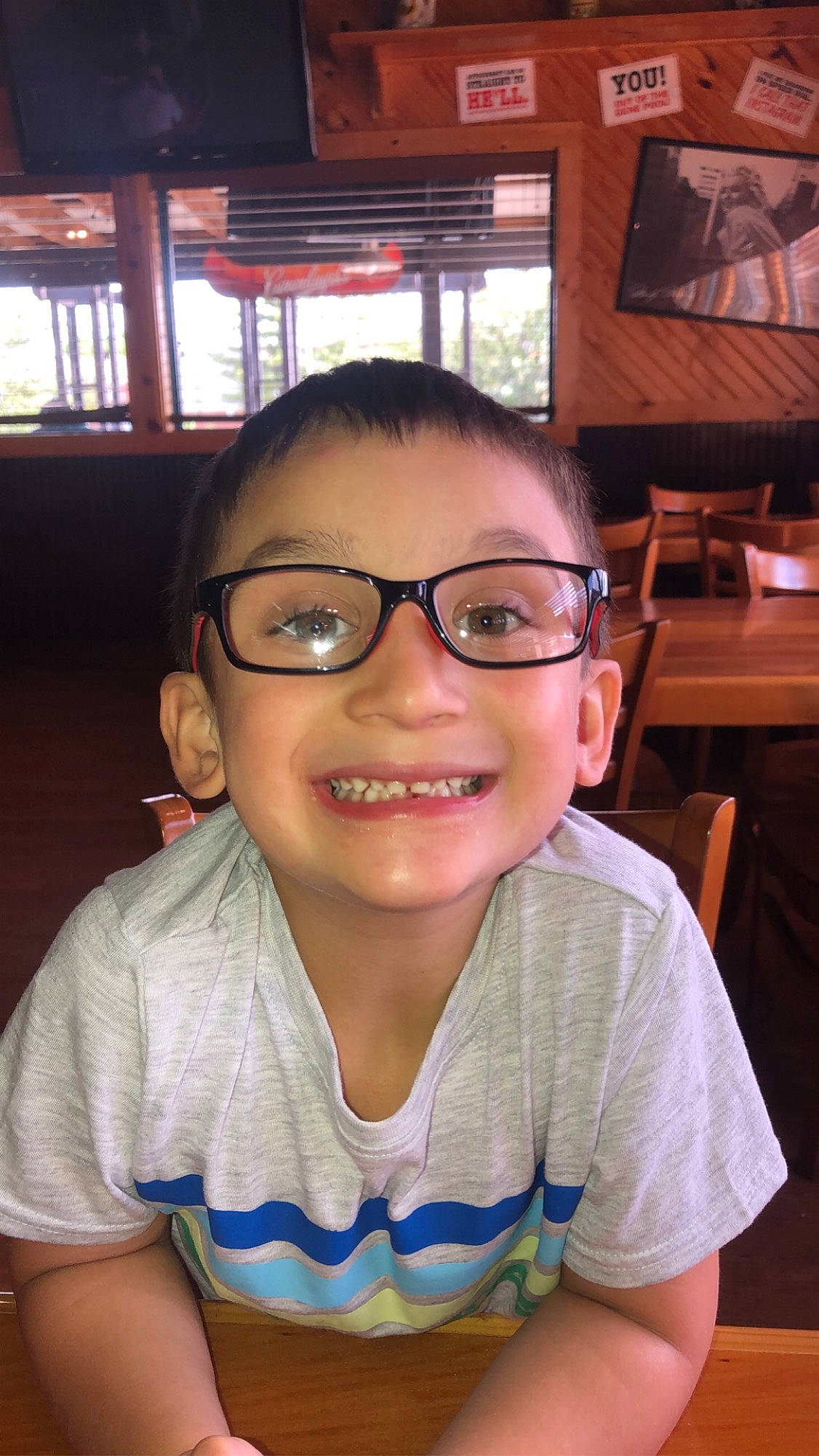 Larenzo is registered to the contest to win money with this photo: cheek, chin, eyebrow, eyewear, face, forehead, fun, glasses, hairstyle, happy, jaw, joy, lip, mouth, nose, person, picture_frame, skin, smile, t_shirt