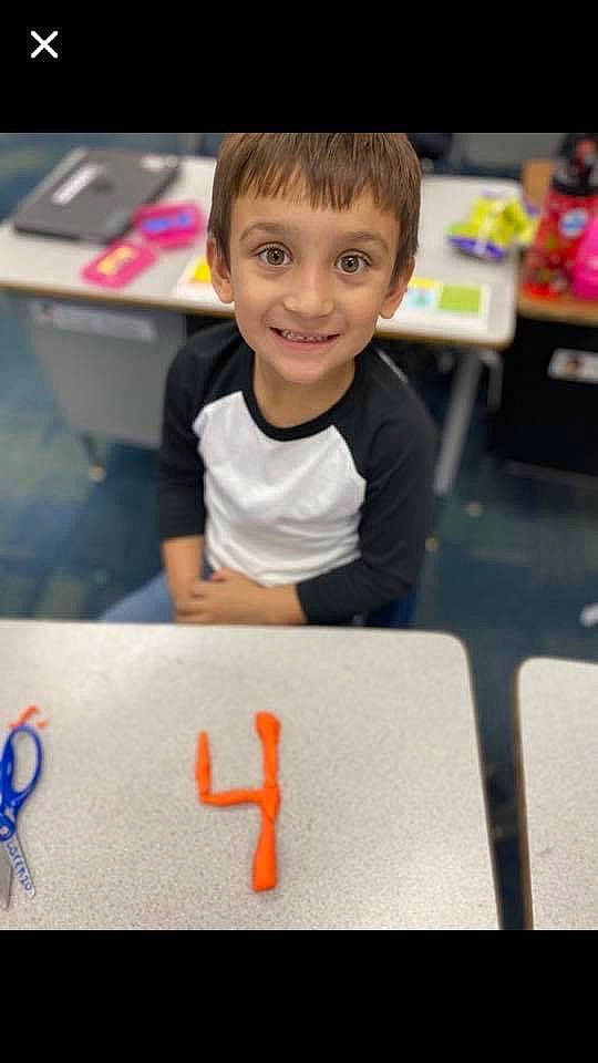 Larenzo joined the competition — help win amazing prizes! chair, child, design, desk, electronic_device, finger, flooring, fun, gadget, happy, joy, person, play, room, sitting, smile, symbol, t_shirt, table, technology