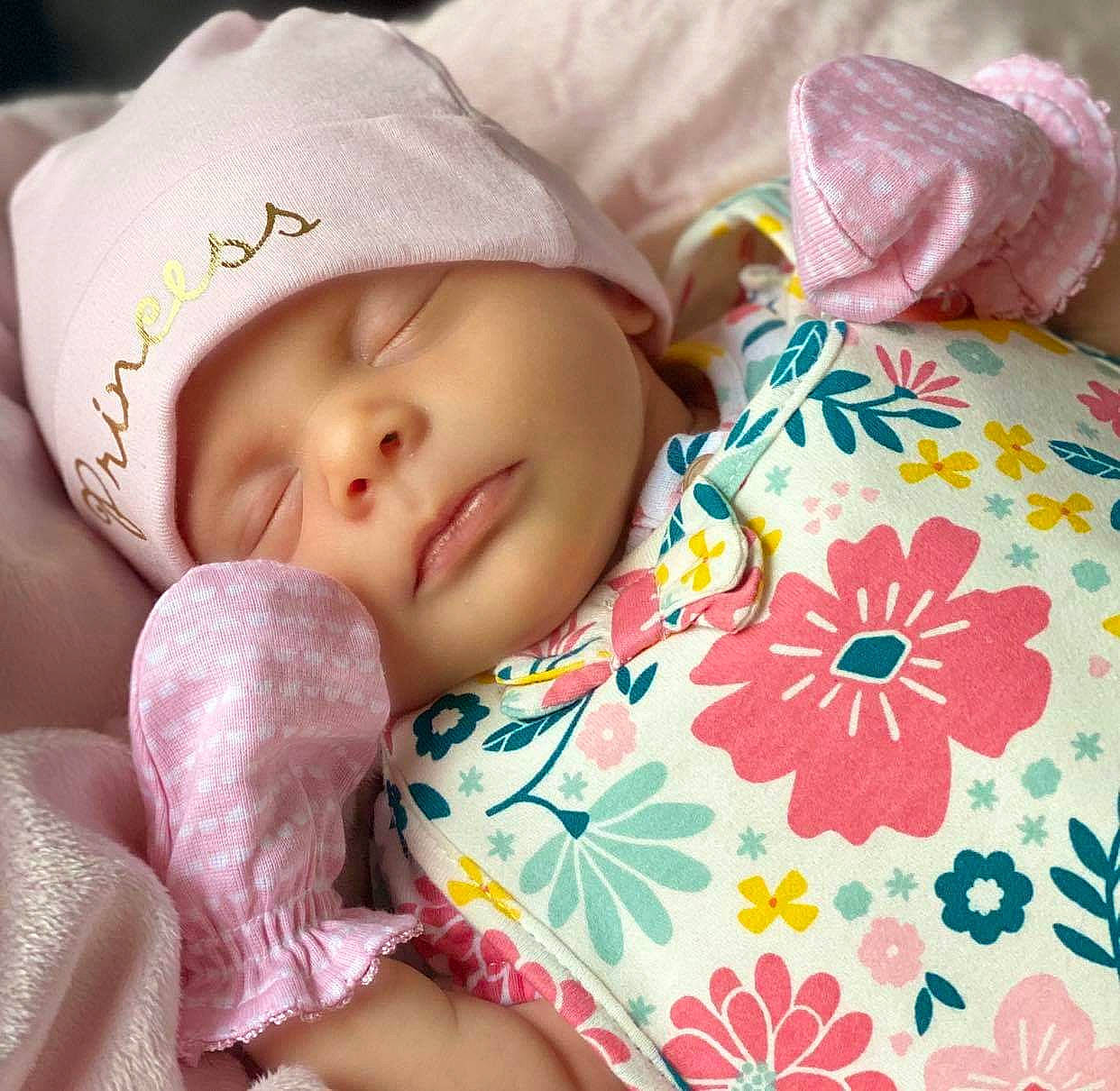 Emillia joined the competition — help win amazing prizes! baby, baby_sleeping, beanie, beauty, bedtime, bonnet, cap, cheek, child, hand, headgear, headwear, knit_cap, linens, lip, nap, person, pink, skin, sleep