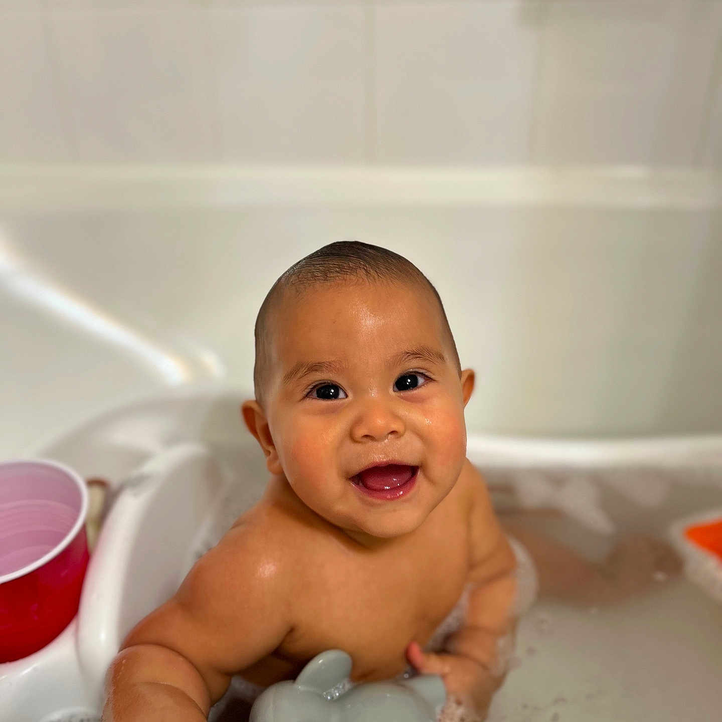 Mateo joined the competition — help win amazing prizes! baby, babylaughing, bathing, bathtub, beverage, coffee, coffeecup, face, happy, head, person, photography, portrait, smile, tub