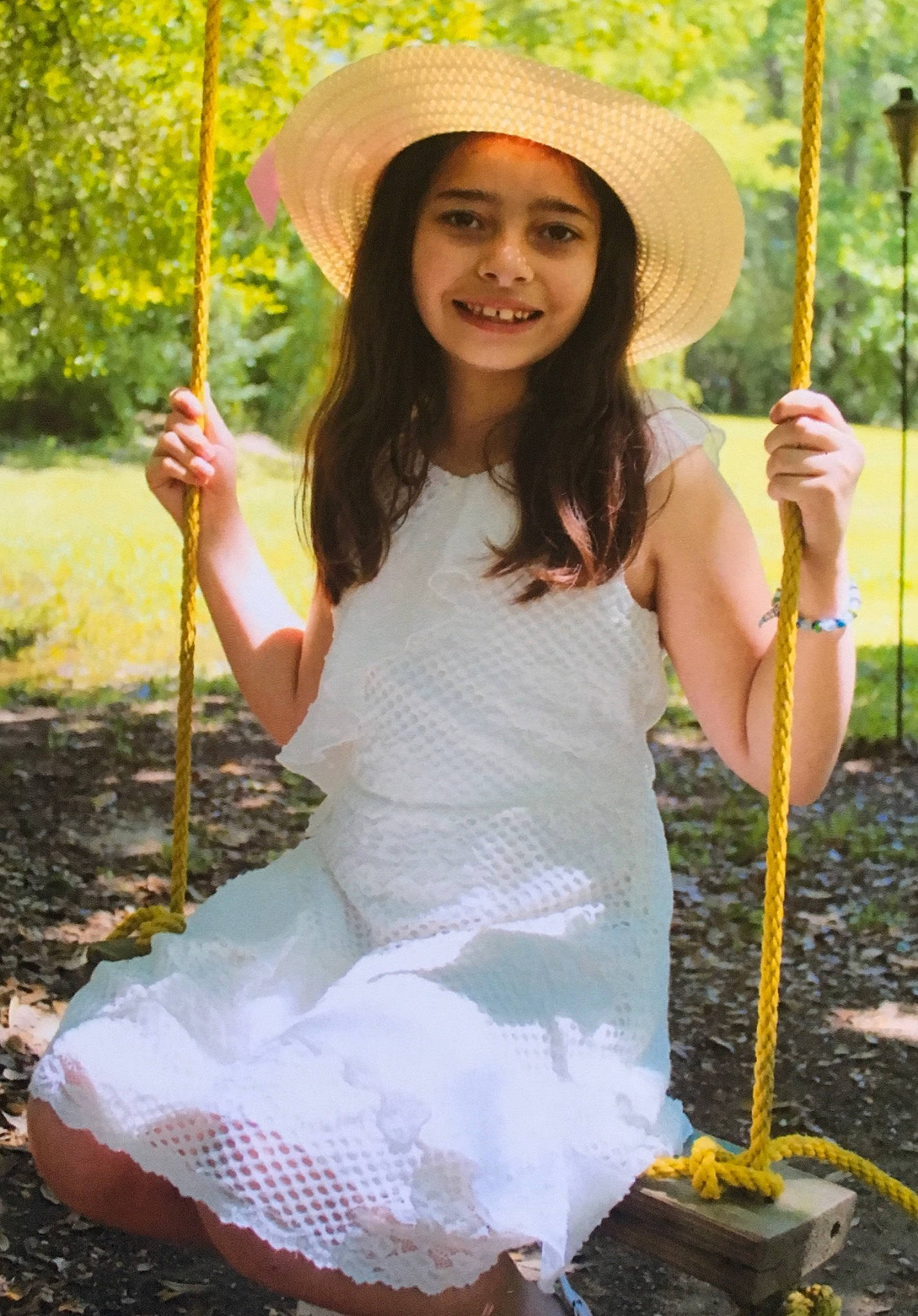 Kenzie joined the competition — help win amazing prizes! dress, fashion_accessory, fun, headwear, joy, leaf, leisure, outdoor_play_equipment, person, photo_shoot, photography, smile, swing, tree