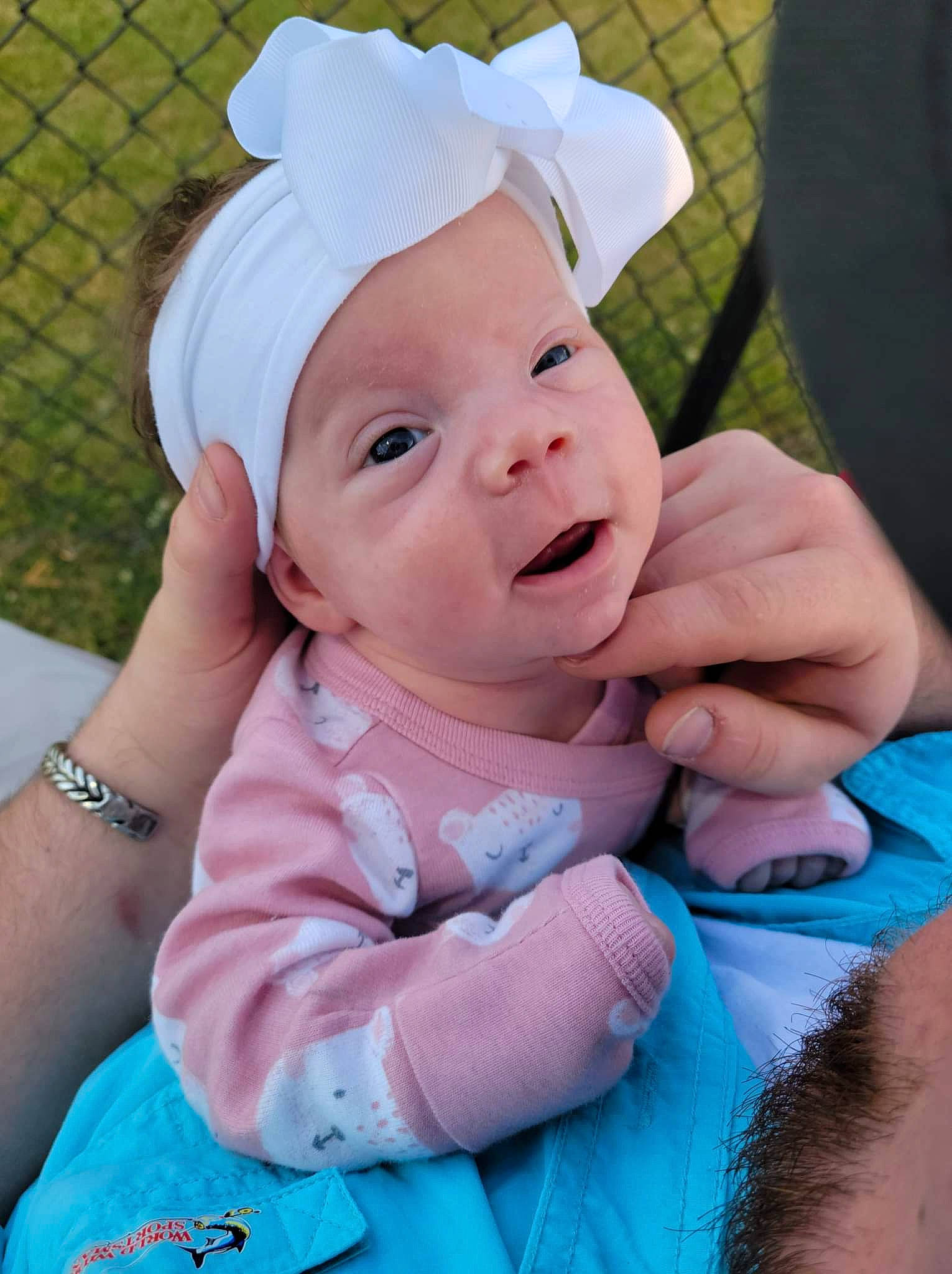 Everly joined the competition — help win amazing prizes! baby, baby_toddler_clothing, blue, cap, child, fence, finger, fun, gesture, grass, happy, headwear, mesh, person, pink, plant, purple, skin, smile, sun_hat