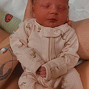 Paisley joined the competition — help win amazing prizes! newborn, baby, sleeping, pajamas, infant, tattoo, hand, hospital, iv_line, bed, blanket, adult, skin, face, portrait, closeup, cute, peaceful, resting, person