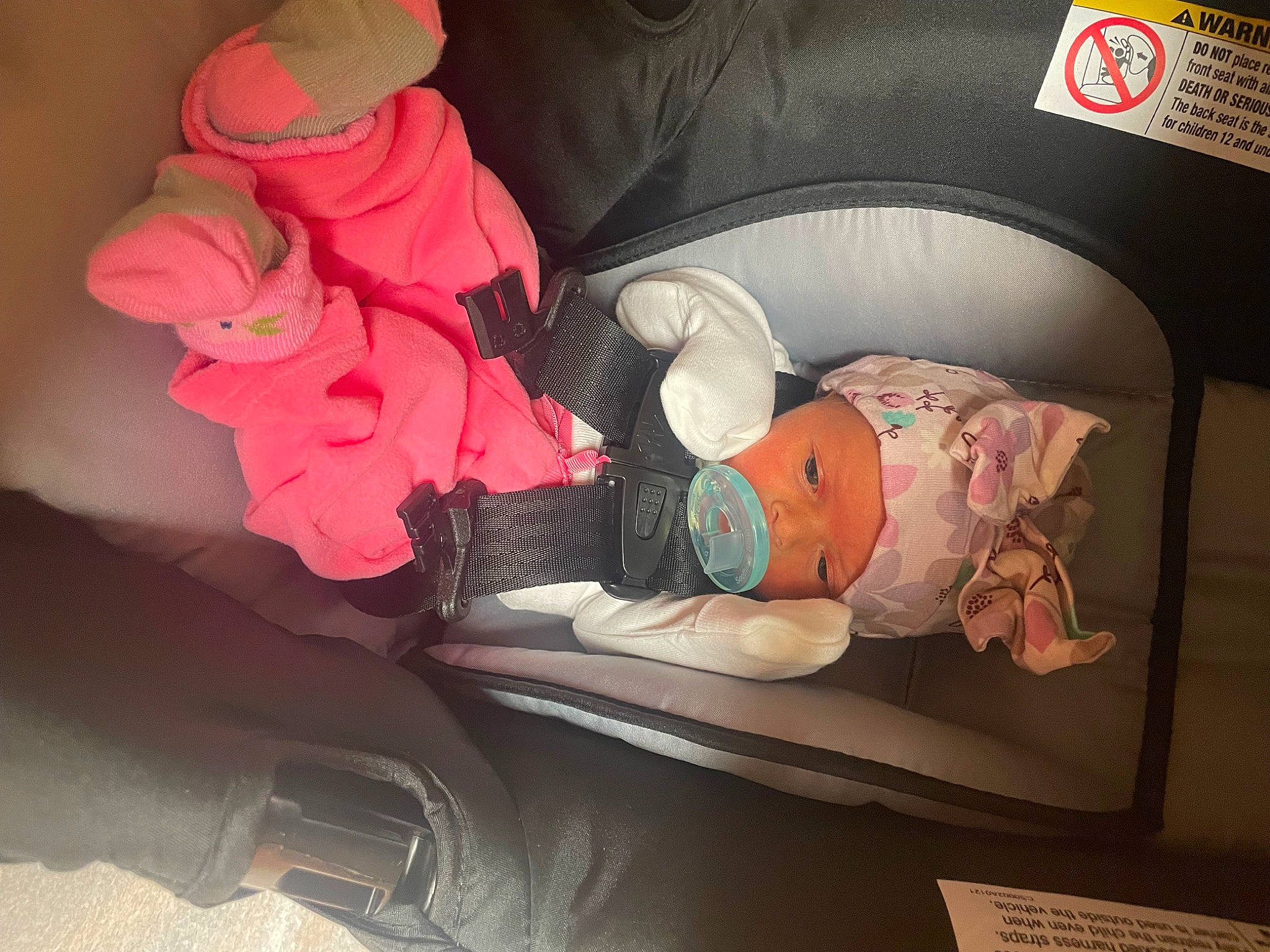 Arabella is registered to the contest to win money with this photo: arm, baby, baby_products, baby_toddler_clothing, car_seat, carmine, child, comfort, family_car, hand, human_body, leg, luxury_vehicle, motor_vehicle, person, petal, pink, room, toddler, vehicle_door