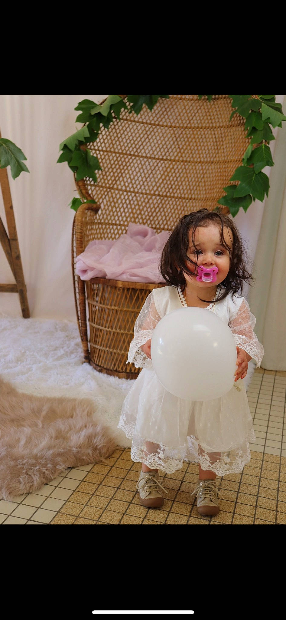 Nella participe au concours pour gagner de l'argent avec cette photo : bridal_accessory, bridal_clothing, bridal_party_dress, dress, embellishment, event, fashion_design, flooring, formal_wear, hair, happy, human_body, person, photograph, plant, shoulder, smile, textile, toddler, white