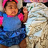 Malaysia joined the competition — help win amazing prizes! baby, child, infant, headband, denim_dress, pink_clothing, blanket, heart_pattern, cushion, chair, indoors, play_mat, cute, smiling, skin, face, legs, feet, bracelet, comfortable