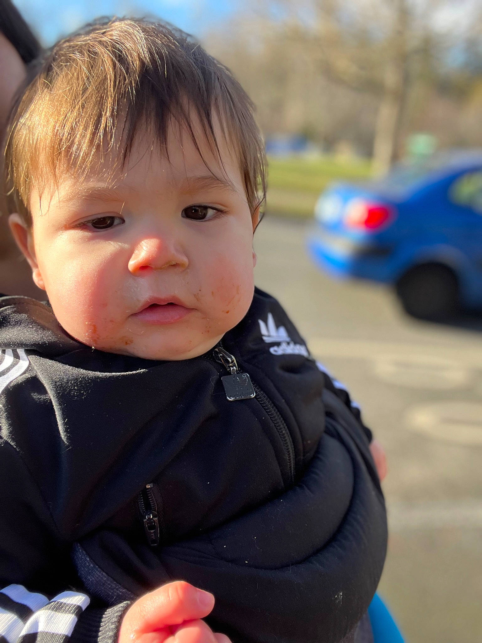 Zaiden is registered to the contest to win money with this photo: automotive_lighting, automotive_tire, baby, baby_toddler_clothing, car, cheek, child, electric_blue, eye, eyebrow, fun, grass, happy, iris, nose, person, sitting, tire, toddler, tree