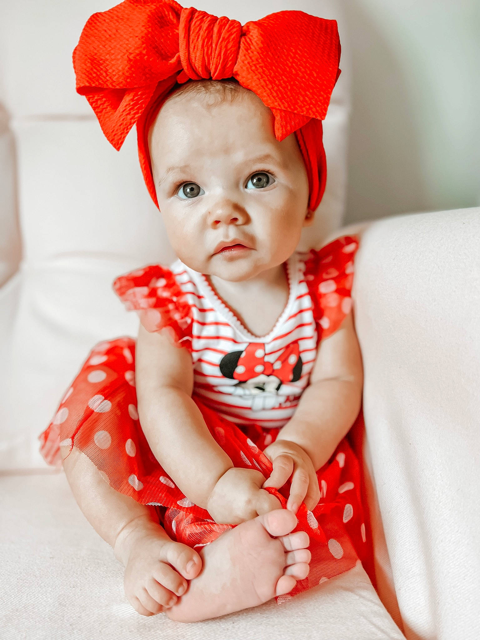 Elleri is registered to the contest to win money with this photo: baby, baby_toddler_clothing, chin, collar, comfort, dress, eye, face, hand, happy, hat, head, headgear, human_body, lip, outerwear, person, pink, skin, sleeve