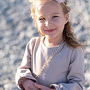 Veronika participe au concours pour gagner de l'argent avec cette photo : child, girl, smile, flower_headband, dress, long_sleeves, outdoor, sunlight, portrait, happy, hands, blurry_background, pebbles, young, cute, fashion, casual, person, daylight, skin