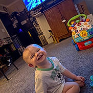 Jackson joined the competition — help win amazing prizes! toddler, child, smile, indoor, carpet, toy, walker, television, cabinet, cat, furniture, living_room, person, happy, floor, seat, casual_clothing, home, cute, play