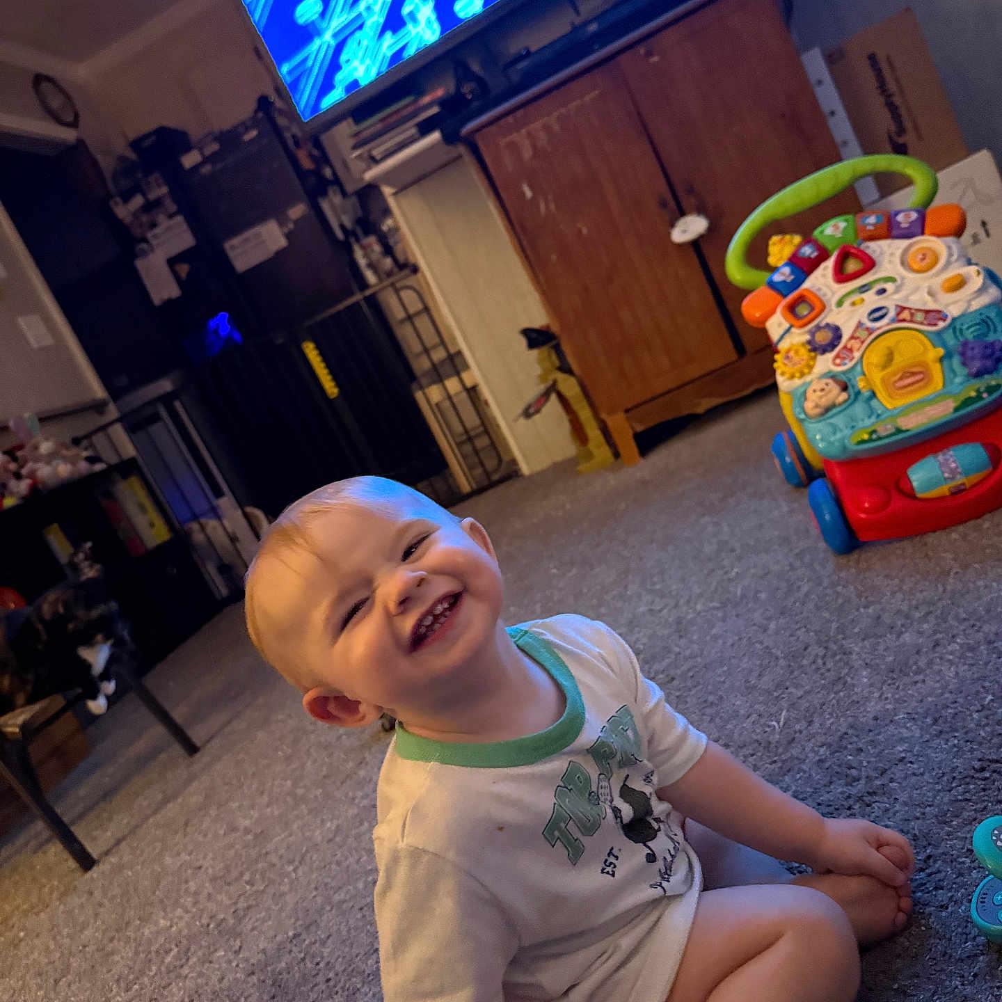 Jackson joined the competition — help win amazing prizes! toddler, child, smile, indoor, carpet, toy, walker, television, cabinet, cat, furniture, living_room, person, happy, floor, seat, casual_clothing, home, cute, play