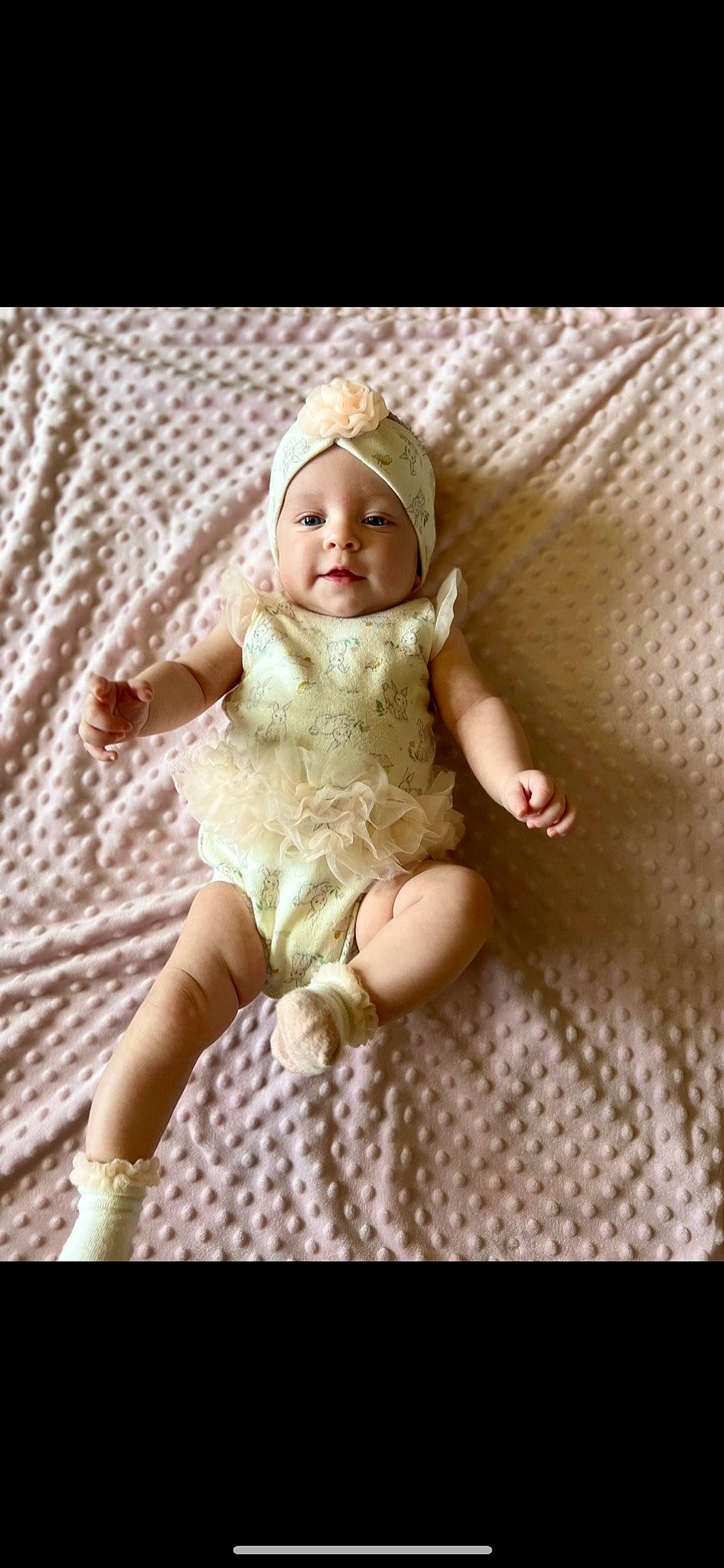 Vivian is registered to the contest to win money with this photo: baby, baby_toddler_clothing, doll, dress, face, fashion_accessory, fawn, foot, hair_accessory, headwear, human_leg, iris, linens, pattern, person, sleeve, smile, textile, thumb, toddler