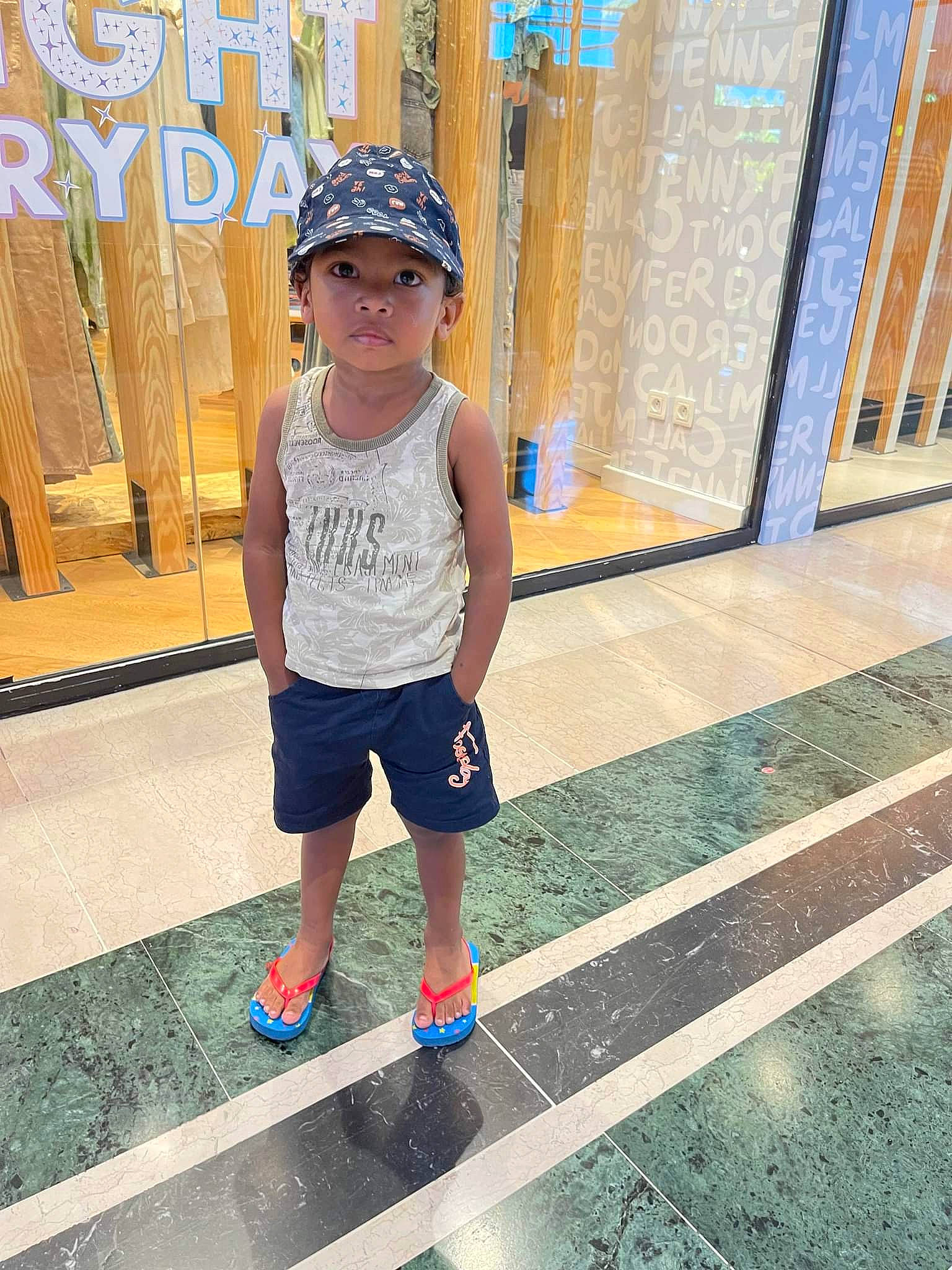 Quentin participe au concours pour gagner de l'argent avec cette photo : baby_toddler_clothing, cool, electric_blue, eyewear, happy, hat, headwear, human_leg, leisure, pattern, person, recreation, shorts, sleeve, sportswear, standing, street_fashion, summer, t_shirt, thigh