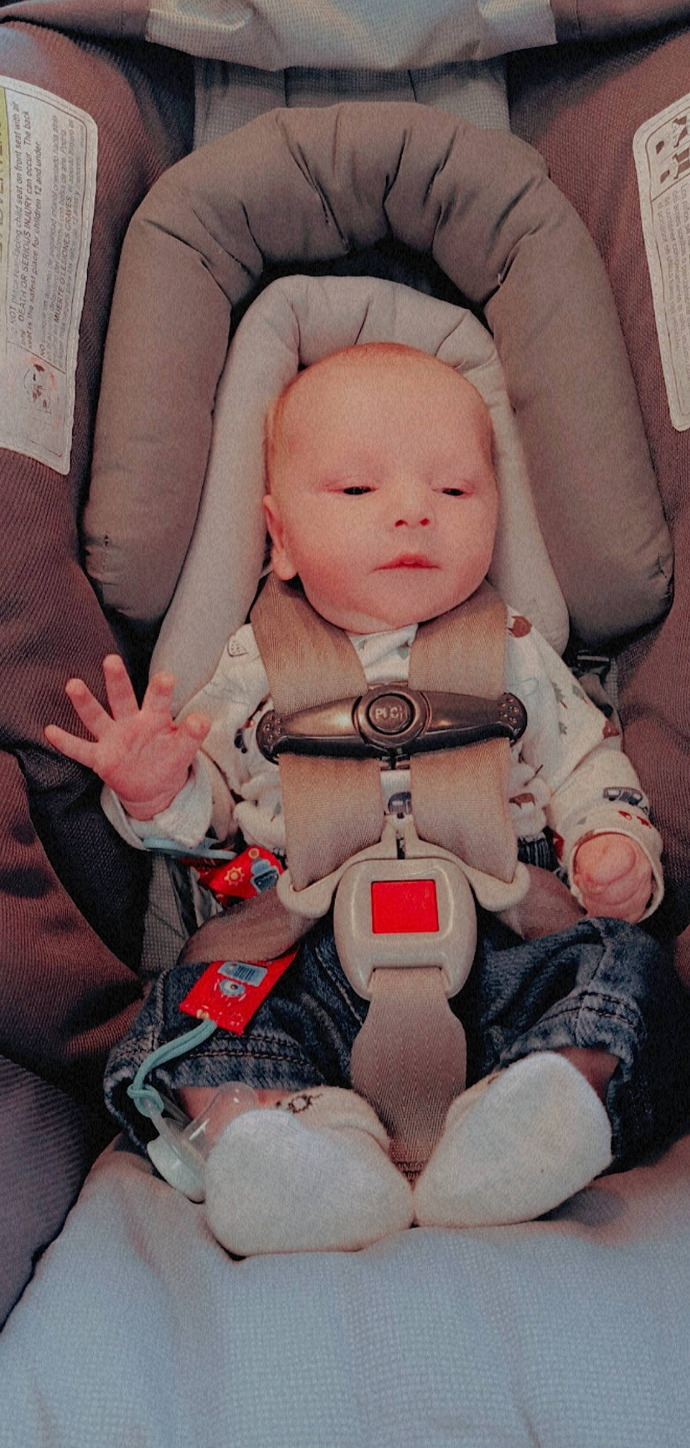 Brantley is registered to the contest to win money with this photo: arm, baby, baby_carriage, baby_toddler_clothing, cheek, comfort, face, finger, head, human_body, knee, nail, person, pink, product, seat_belt, skin, thigh, thumb, toddler