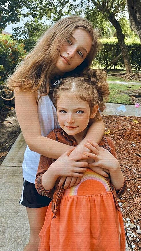 Kennedy is registered to the contest to win money with this photo: botany, dress, facial_expression, fashion, gesture, grass, hair, hairstyle, happy, iris, joy, leaf, mammal, organ, people_in_nature, person, photograph, plant, shoulder, smile