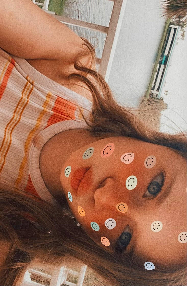 Kennedy is registered to the contest to win money with this photo: arm, body_piercing, chest, cool, eyelash, finger, gesture, hand, head, human_body, joint, lip, mouth, muscle, neck, orange, person, shoulder, skin, thigh