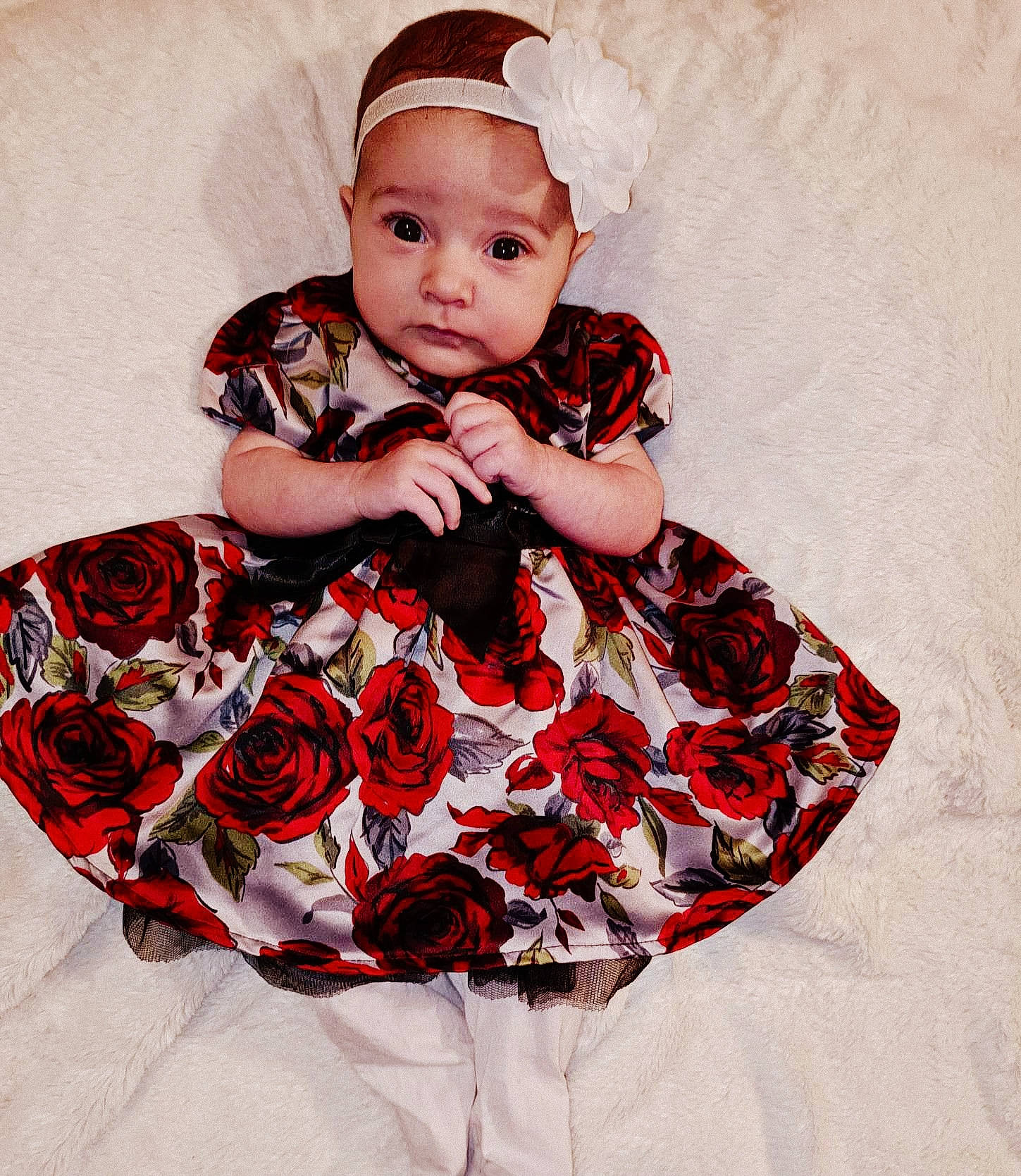 Lillyana is registered to the contest to win money with this photo: baby, baby_products, baby_toddler_clothing, collar, costume_hat, day_dress, dress, embellishment, event, fashion_accessory, hair_accessory, headpiece, headwear, magenta, pattern, person, petal, pink, red, sleeve