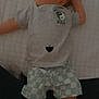 Sawyer joined the competition — help win amazing prizes! baby, infant, child, tshirt, shorts, yin_yang, patterned_clothing, quilted_surface, lying_down, curious_expression, blue_eyes, light_skin, short_hair, footwear, legs, hand, black_heart_emoji, casual_clothing, indoors, person