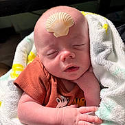 River joined the competition — help win amazing prizes! baby, infant, sleeping, blanket, shell, hand, face, clothing, cute, soft, newborn, peaceful, resting, indoors, skin, head, closed_eyes, wrapped, tiny, adorable