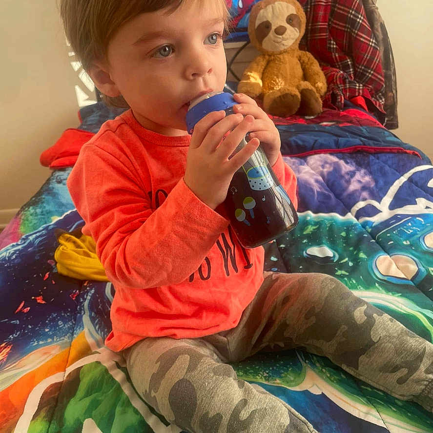 Tyler joined the competition — help win amazing prizes! beverage, bodypart, bottle, boy, child, couch, cushion, face, finger, furniture, hand, head, homedecor, indoors, interiordesign, male, person, photography, portrait, shaker