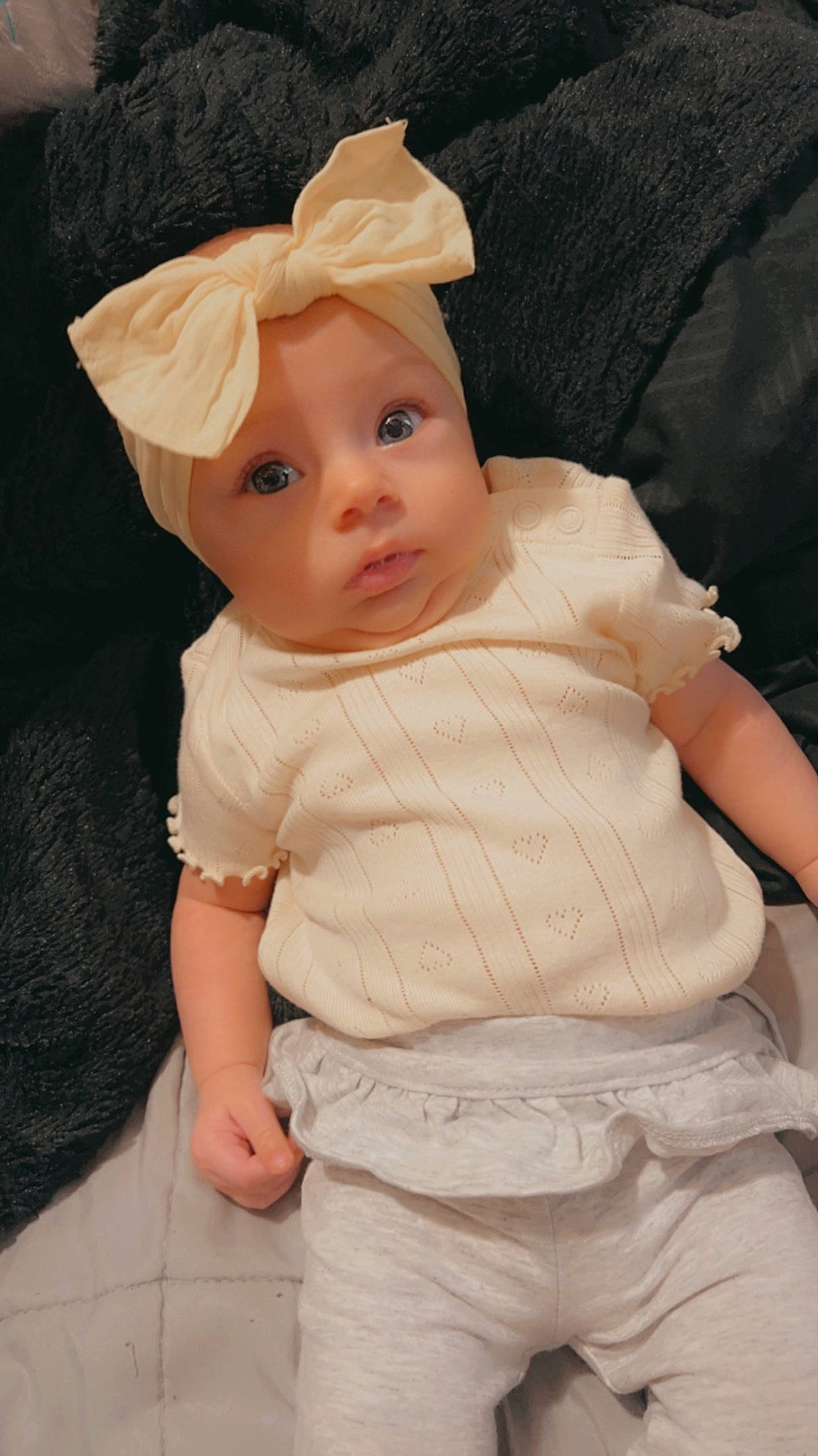 Emersyn is registered to the contest to win money with this photo: baby, baby_toddler_clothing, cap, cheek, comfort, eye, fashion_accessory, fur, headgear, headwear, human_body, iris, knit_cap, linens, lip, nose, person, skin, sleeve, textile