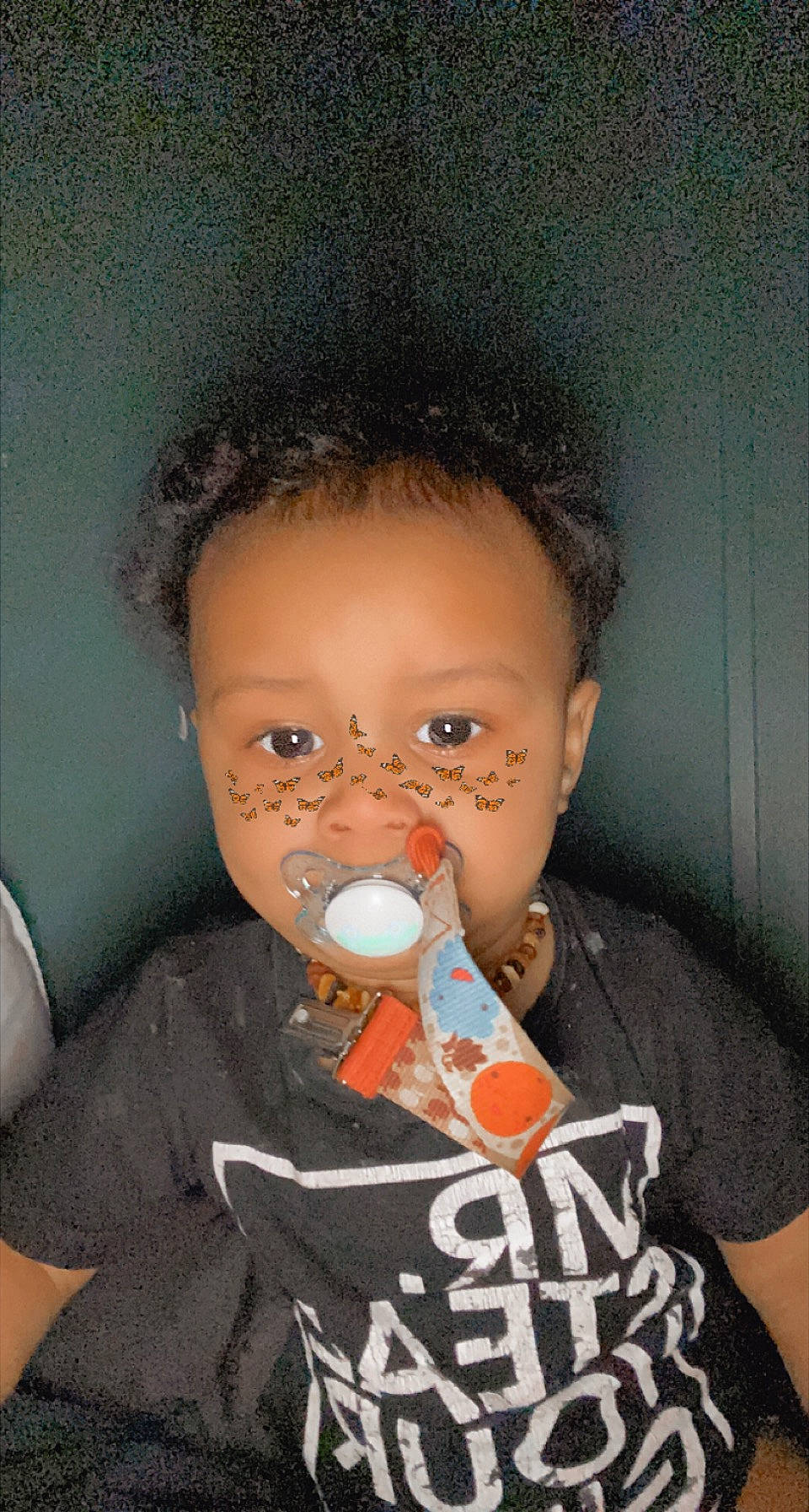 Korbin is registered to the contest to win money with this photo: afro, baby, baby_toddler_clothing, black_hair, cheek, chin, cool, drinkware, ear, eyebrow, eyelash, finger, forehead, hairstyle, jheri_curl, lip, mouth, nose, person, skin