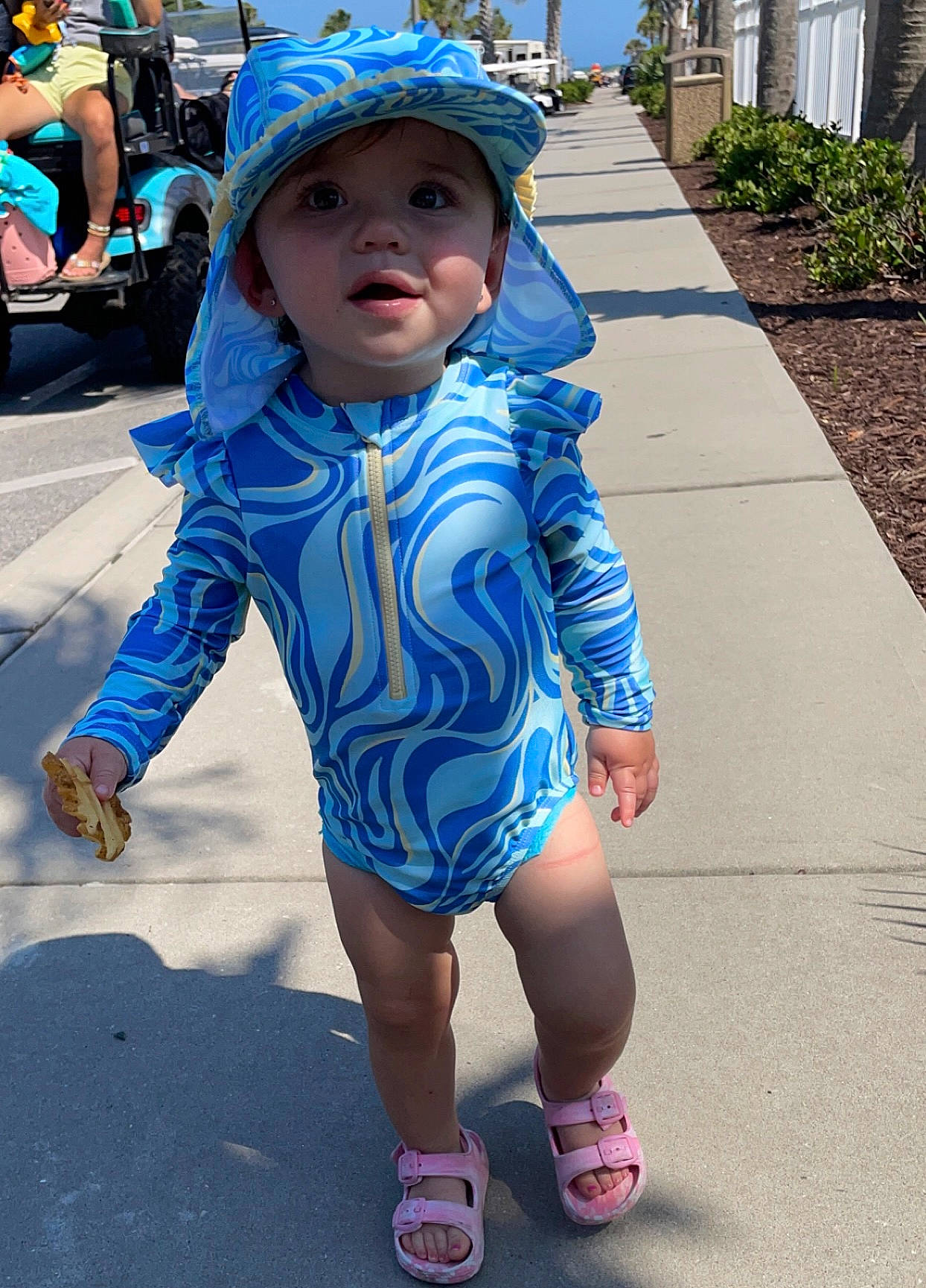 Blakeley is registered to the contest to win money with this photo: asphalt, azure, blue, cool, electric_blue, fun, happy, hat, headgear, headwear, leisure, magenta, person, photograph, pink, plant, play, recreation, shoe, sleeve