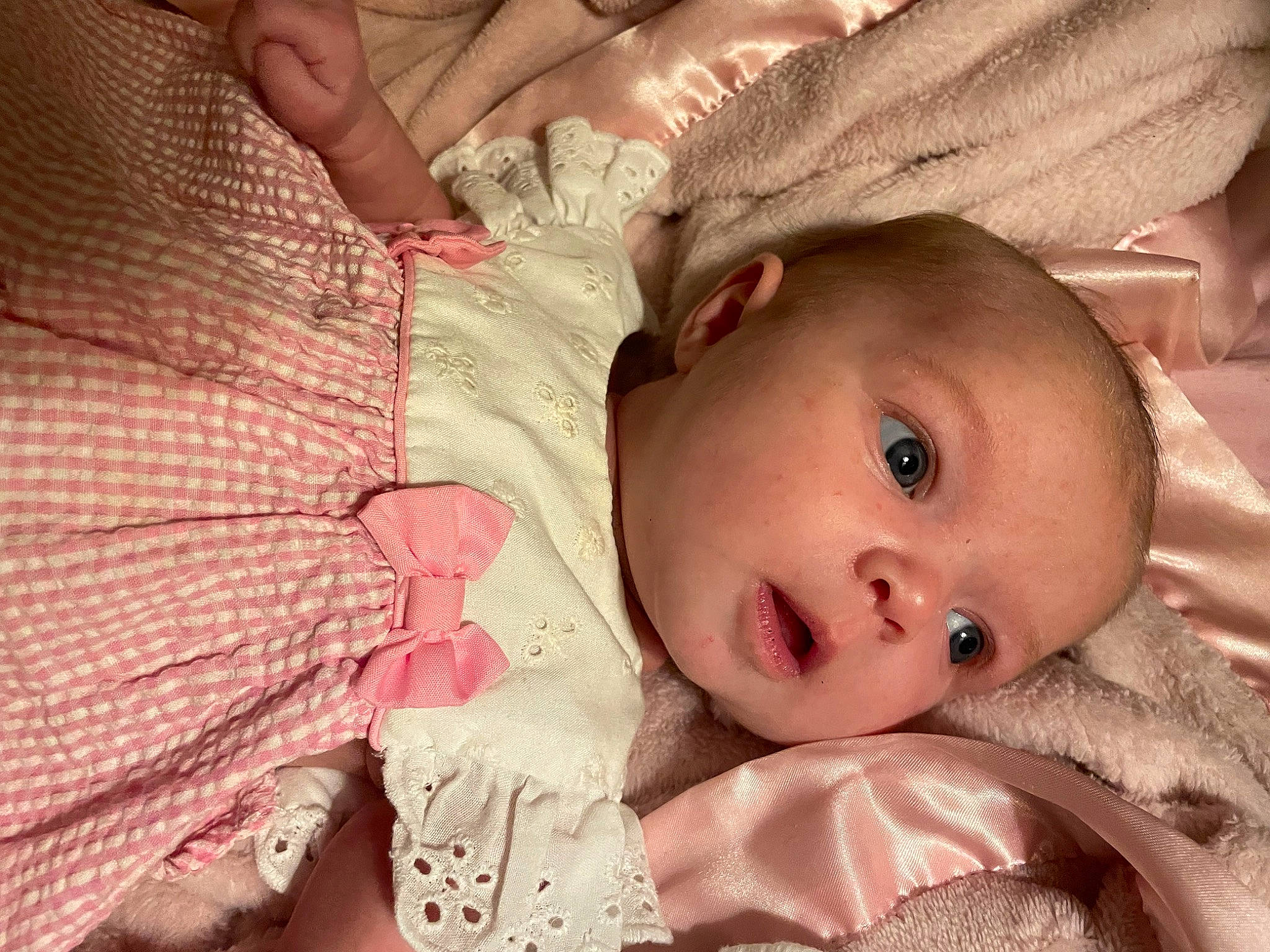 Bella is registered to the contest to win money with this photo: baby, baby_toddler_clothing, cheek, chin, close_up, comfort, eye, eyelash, facial_expression, finger, hand, headgear, human_body, iris, lip, mouth, nose, person, pink, skin