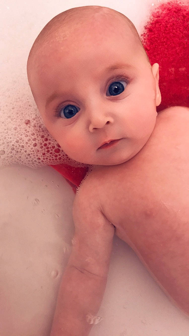 Connie is registered to the contest to win money with this photo: baby, baby_bathing, baby_making_funny_faces, bathing, cheek, child, chin, close_up, eye, eyebrow, face, forehead, head, iris, lip, mouth, muscle, nose, person, skin