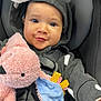 Aniyah is registered to the contest to win money with this photo: baby, child, car_seat, hoodie, plush_toy, blanket, smiling, blue_eyes, cute, infant, seatbelt, soft_toy, clothing, happy, portrait, indoor, cozy, baby_toy, childrens_clothing, face