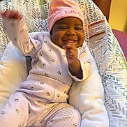 Ahzani joined the competition — help win amazing prizes! baby, smiling, pink_clothing, hat, infant, baby_seat, cushion, happy, indoor, child, person, cozy, cute, portrait, relaxing, comfort, small_child, toddler, warm, seated