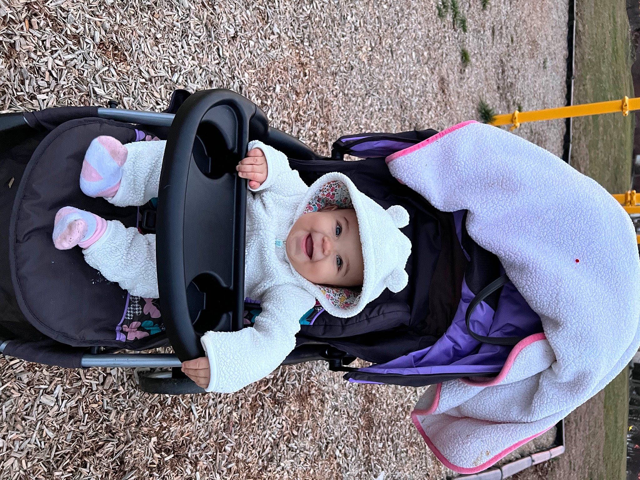 Mayliani is registered to the contest to win money with this photo: baby, baby_carriage, baby_products, baby_toddler_clothing, child, comfort, costume, fun, grass, headwear, joy, leisure, person, personal_protective_equipment, recreation, sitting, toddler, tree, vacation, winter