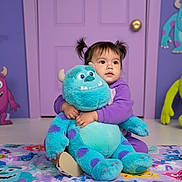 Avia is registered to the contest to win money with this photo: blue_monster, cartoon_monsters, child, colorful_blanket, cute, decorations, door, floor, happy, hugging, indoor, monster_theme, pigtails, playroom, plush_toy, purple_pajamas, smiling, soft_toy, toddler, young_child