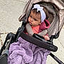 Avia is registered to the contest to win money with this photo: toddler, child, stroller, blanket, headband, outdoor, sidewalk, baby, purple, clothing, person, portrait, curious, warm, bundle, wheelchair_accessory, evenflo, baby_carriage, urban, casual
