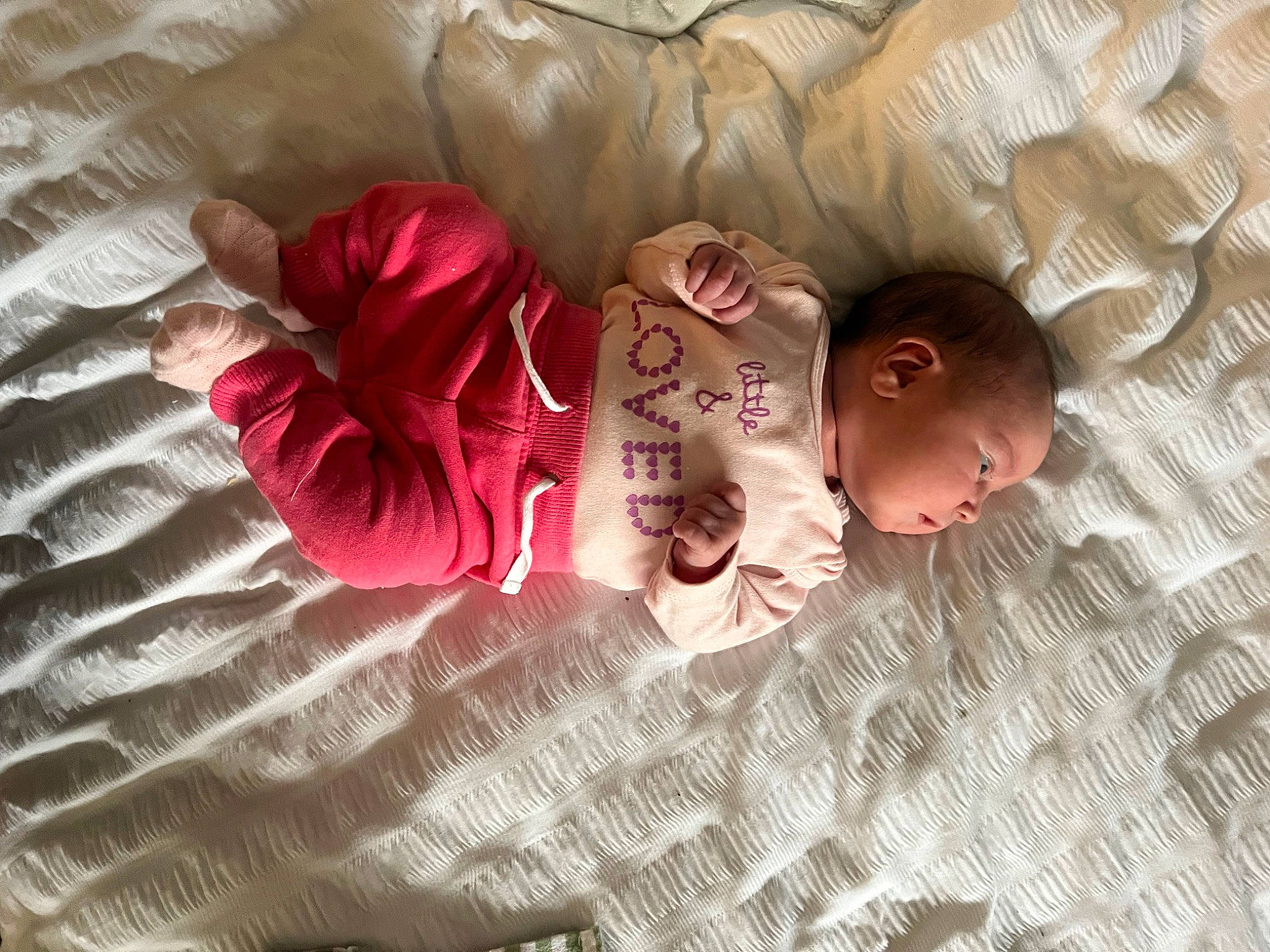 Aubree is registered to the contest to win money with this photo: baby, baby_products, baby_toddler_clothing, bedding, bedtime, carmine, child, comfort, flooring, font, linens, magenta, nap, pattern, person, pink, room, sitting, sleeve, toddler