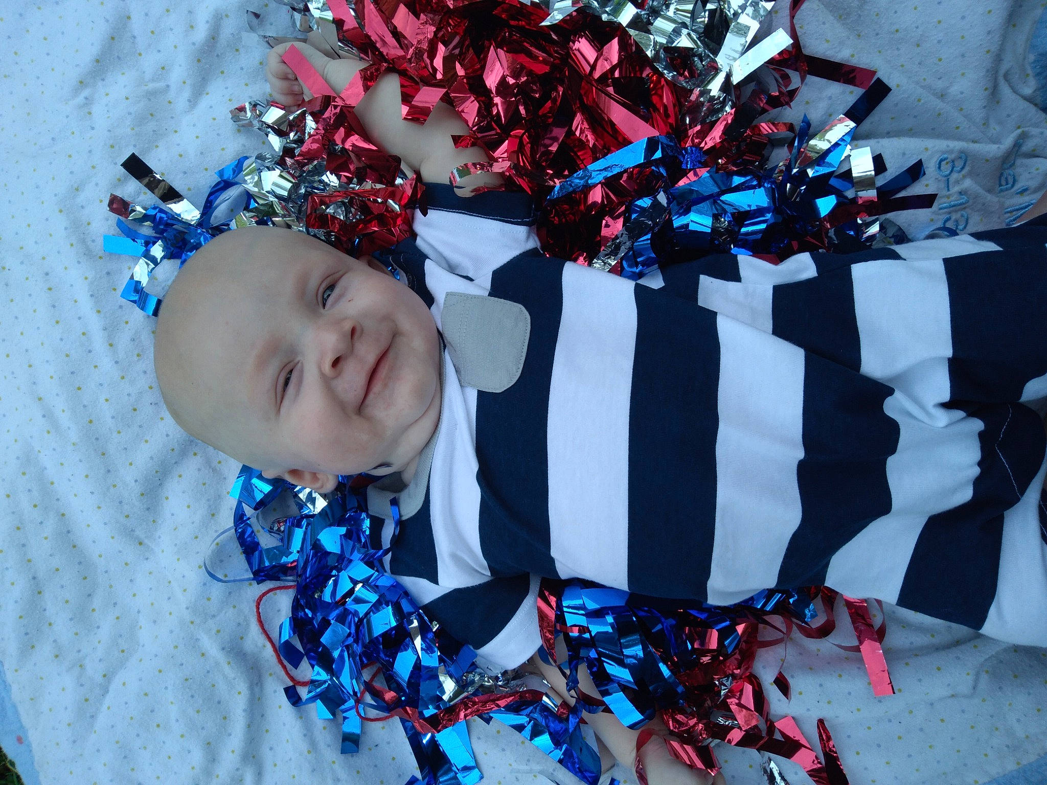 Damion joined the competition — help win amazing prizes! azure, baby, baby_toddler_clothing, blue, child, costume_hat, electric_blue, event, fashion_accessory, fun, hair_accessory, happy, headgear, jewellery, pattern, person, plant, red, smile, textile