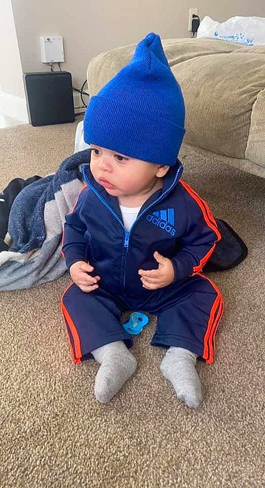 Kayden joined the competition — help win amazing prizes! azure, baby, baby_toddler_clothing, beanie, bonnet, cap, child, comfort, drawer, electric_blue, fashion_accessory, flooring, grass, headwear, knit_cap, person, sitting, sleeve, toddler, winter