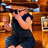 Weston is registered to the contest to win money with this photo: baby, child, sunglasses, hat, denim_overalls, bandana, barefoot, indoor, wooden_floor, cute, portrait, fashion, cool, baby_pose, infant, child_fashion, casual, smiling, person, seated