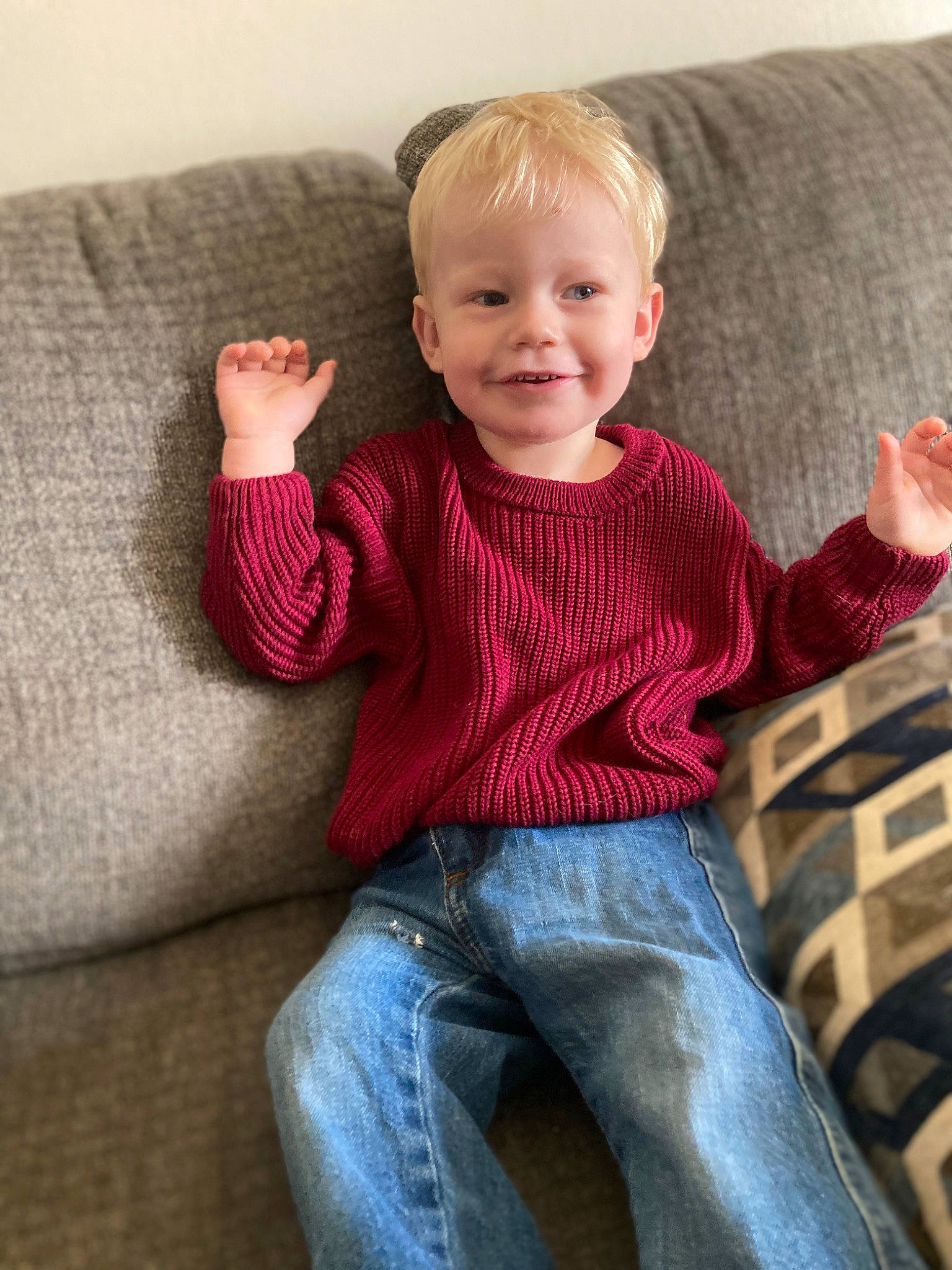 Mikey joined the competition — help win amazing prizes! arm, baby_toddler_clothing, cheek, clothing, comfort, couch, eye, finger, furniture, human_body, jeans, joy, leg, muscle, person, skin, sleeve, smile, standing, textile